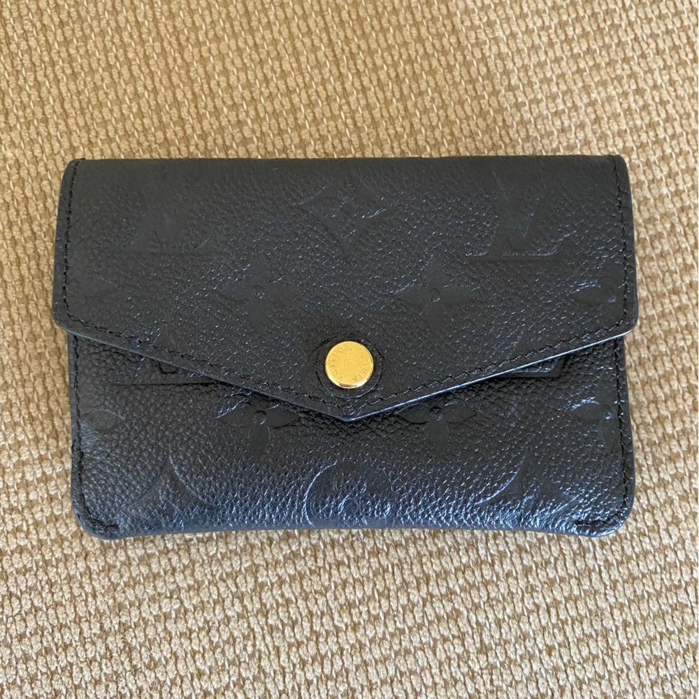AUTHENTIC Louis Vuitton embossed leather key pouch.